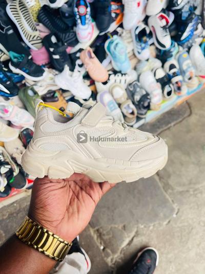 Cream color children’s sneaker