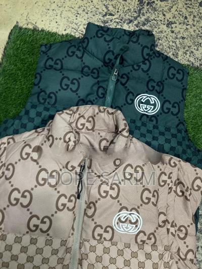 Gucci Monogram Puffer Vests: