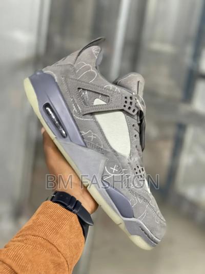 Kaws X Air Jordan 4: Premium Grey Suede